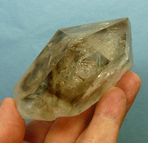 High quality "venster" quartz crystal with stunningly shaped windows