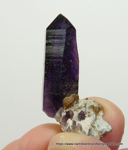 Dark amethyst quartz crystal on small matrix