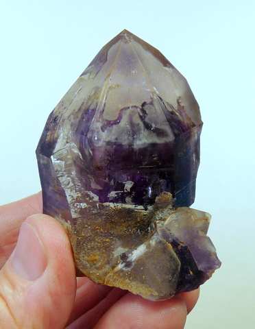 Amethyst quartz crystal with patches of chalcedony