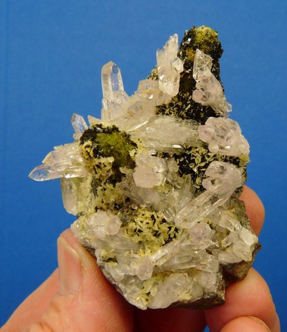 Crystals of quartz, prehnite, epidote and calcite on matrix