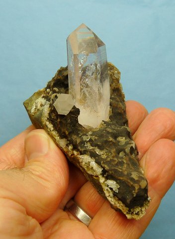 Two quartz crystals, the biggest with inclusions, on matrix