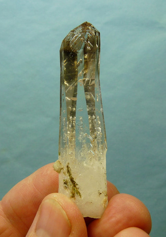 Stunning, gemmy quartz crystal with gas inclusions and smoky tip