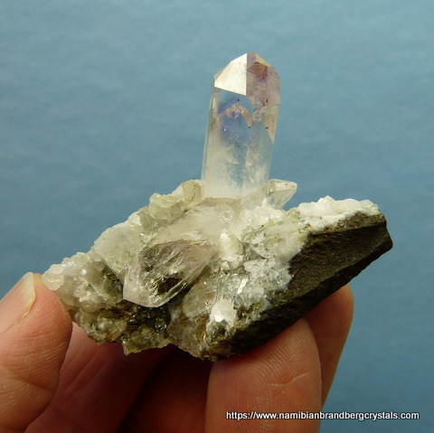 A pale blue topaz crystal with nice facets and termination