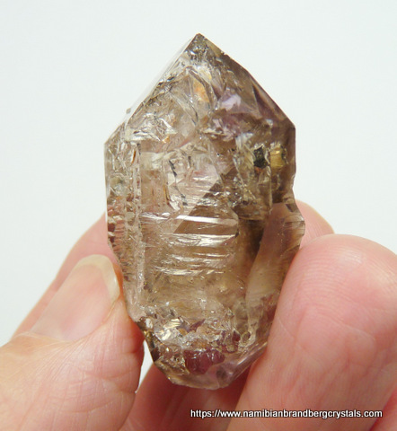 Clear quartz crystal with lovely gas inclusions