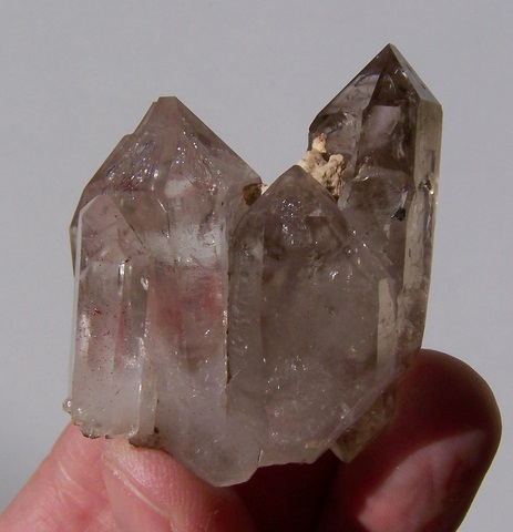 Lovely, gemmy group of quartz crystals, ranging in colour from clear to light smoky.