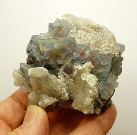 Phantom quartz cluster with lovely light orangy-red phantoms Phantom quartz cluster with lovely light orangy-red phantoms