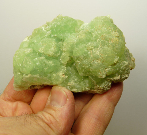 Prehnite conglomerate crystals on thin basalt matrix