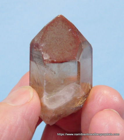 Quartz crystal with hematite inclusions