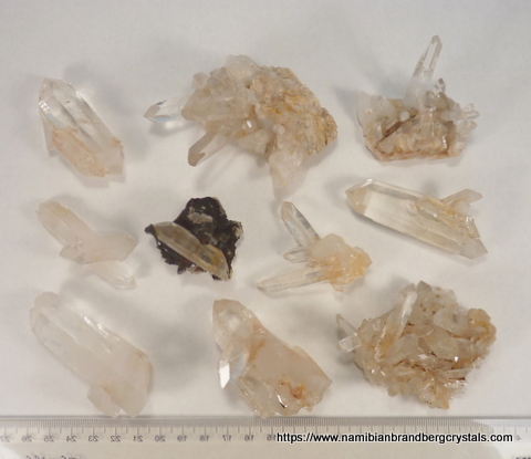 Ten clear quartz crystal specimens