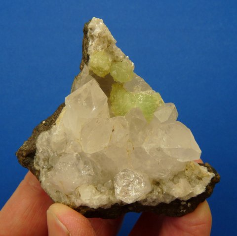 Lovely quartz, prehnite and calcite crystals on basalt matrix