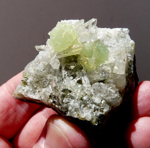 Balls of prehnite and quartz crystals on matrix