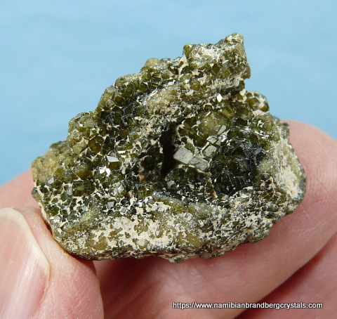 Cluster of small demantoid garnets