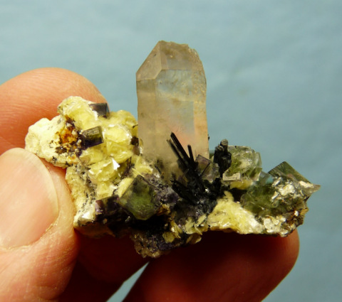 Greenish fluorite crystals and muscovite on schorl crystal