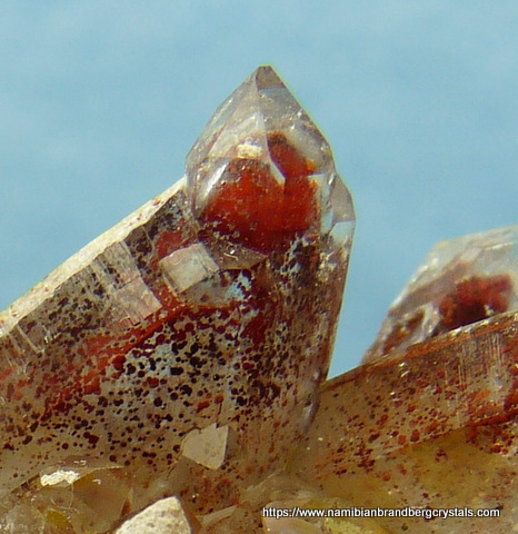 Quartz crystal group with bright red and speckled phantoms