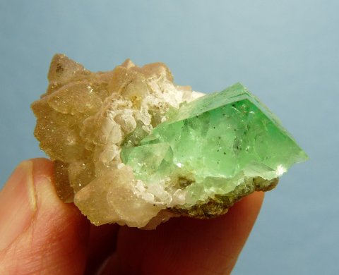 Gemmy, green fluorite crystal with pyrite inclusions, on quartz