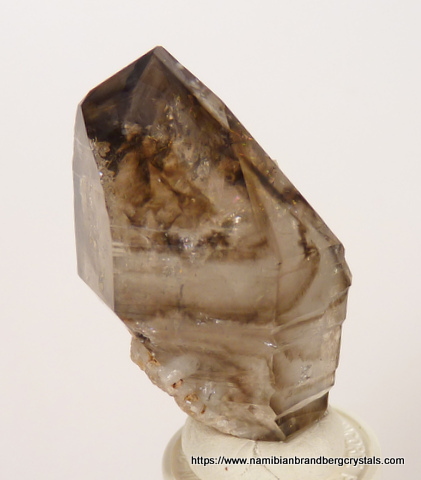 Quartz crystal with lovely rainbow and clouds of smoky colouring