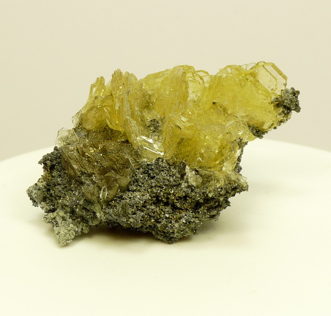 Bladed barite crystals with ?pyrite crystals, on matrix