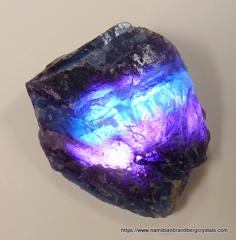 Banded fluorite piece viewed with light from behind